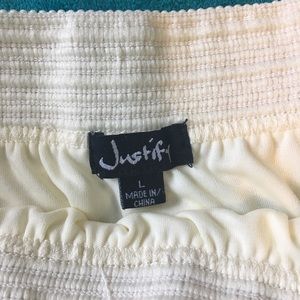 Large white justify skirt.